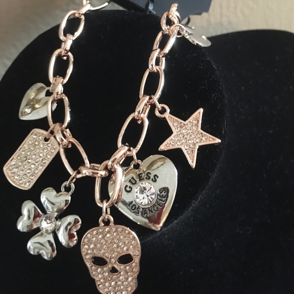 Guess Skull Hearts Star Clover Charm Bracelet